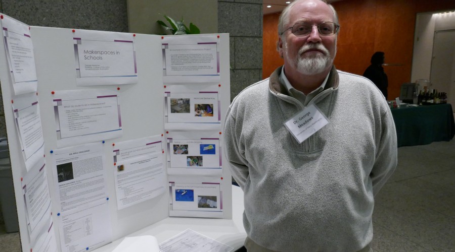 Man standing in front of poster presentation.